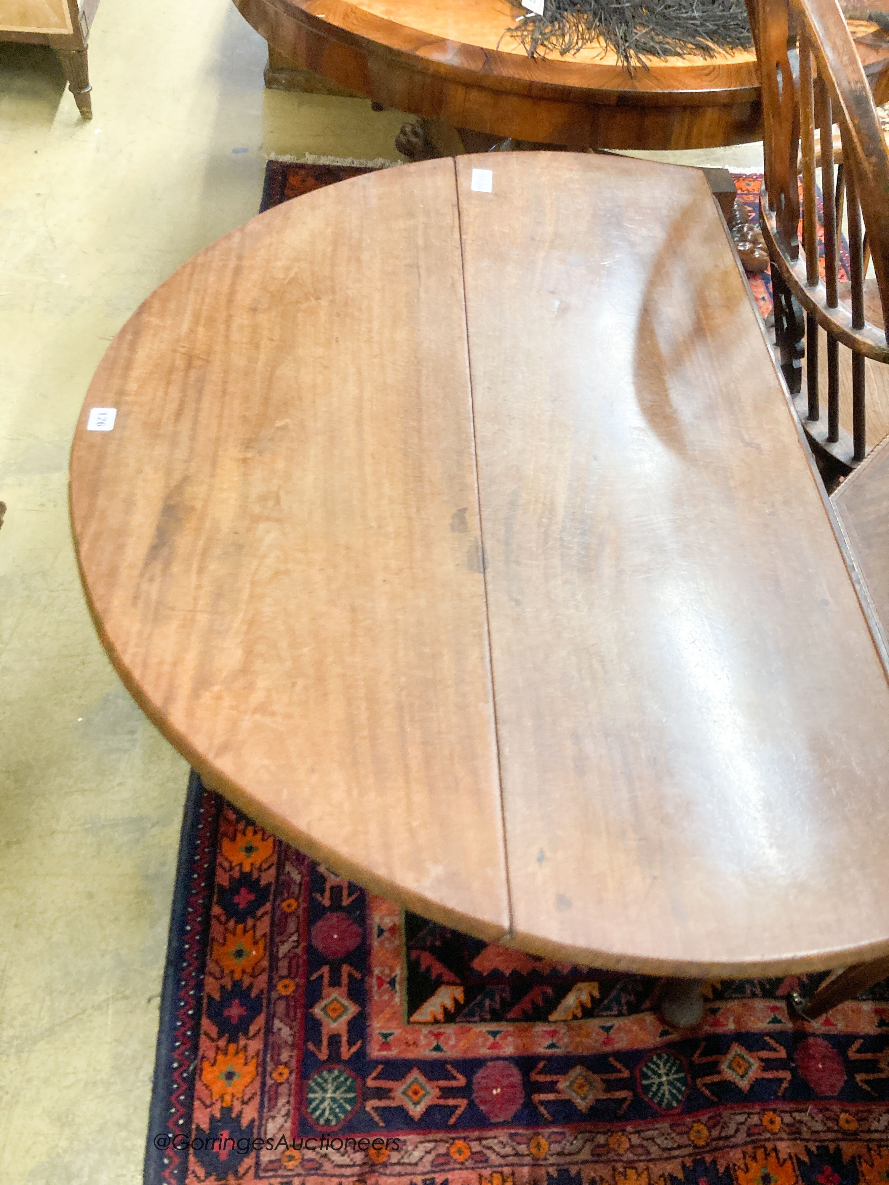 A George III mahogany pad foot drop leaf dining table, length 115cm extended, width 110cm, height 72cm